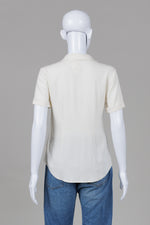 Load image into Gallery viewer, Theory crème short sleeve cuffed covered button blouse (S)
