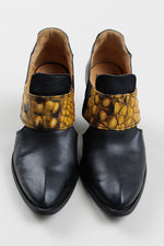 Load image into Gallery viewer, John Fleuvog black slip on booties with cut out and yellow &amp; black strap detail (9.5)
