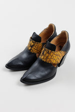 Load image into Gallery viewer, John Fleuvog black slip on booties with cut out and yellow &amp; black strap detail (9.5)
