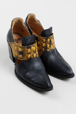 Load image into Gallery viewer, John Fleuvog black slip on booties with cut out and yellow &amp; black strap detail (9.5)
