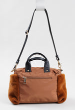 Load image into Gallery viewer, THREE FOUR TIME brown faux fur and vinyl crossbody bag, small watermark present on back.
