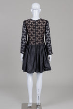 Load image into Gallery viewer, Moma black long sleeve dress with croche lace bodice over nude toned lining and flared pleated skirt (40)
