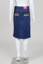 Load image into Gallery viewer, Betsey Johnson blue denim skirt with back pocket flame design (M)
