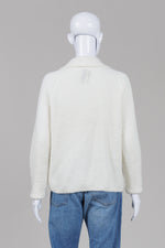 Load image into Gallery viewer, Handmade ivory cardigan with collar and front buttons and pockets
