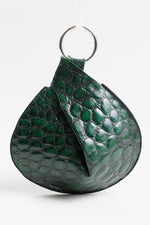 Load image into Gallery viewer, Turbine by Lisa Draper-Murphy green alligator print wristlet with silver bangle.
