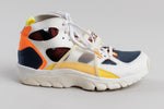 Load image into Gallery viewer, Nike Air Trainer Huarache ‘City Pride Houston’ sneakers with cream and navy colorway  and orange and yellow accents (6.5)
