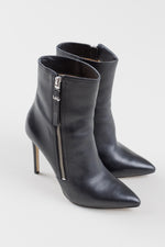 Load image into Gallery viewer, Michael Kors black stiletto pointed toe ankle books with silver zipper (7)
