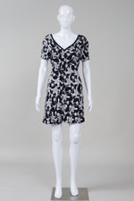 Load image into Gallery viewer, Sandro Black and White floral print short sleeve dress with deep V back
