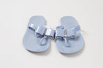 Load image into Gallery viewer, Michael Kors dusky blue jelly thong sandal with bow and silver metal accents (7)
