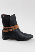 Load image into Gallery viewer, BCBG Max Azria black pebble leather booties with tan strap detail (37)
