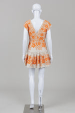 Load image into Gallery viewer, Maje short dress with bright orange emroidery with a deep v-neck neckline (38)
