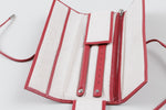 Load image into Gallery viewer, Birks red leather jewelry travel case with tie closure and interior organization pockets and straps.
