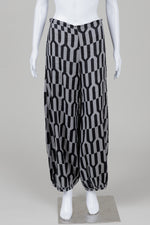 Load image into Gallery viewer, Bryn Walker black and grey geometric print palazzo pants with cinched ankle (S) *new with tags $229
