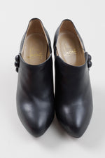 Load image into Gallery viewer, Christian Louboutin Black leather stiletto booties with button detail (38); Resoled with dustbag
