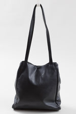 Load image into Gallery viewer, By Paloma Picasso vintage black leather handbag with snap closure and outer snap closure pocket
