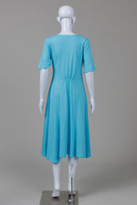 Load image into Gallery viewer, Fenini sky blue short sleeve jersey dress w/ assymetrical cuts (S)
