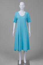 Load image into Gallery viewer, Fenini sky blue short sleeve jersey dress w/ assymetrical cuts (S)

