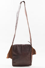Load image into Gallery viewer, Hand Crafted leather messenger bag with horn detail.
